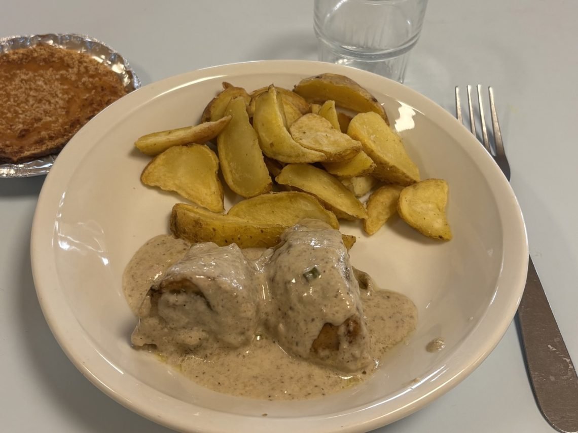 Christmas lunch at a French elementary school with stuffed chicken, potatos and scallop puree.