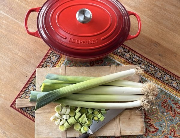 French leek soup for weight loss ingredients on a wooden chopping board