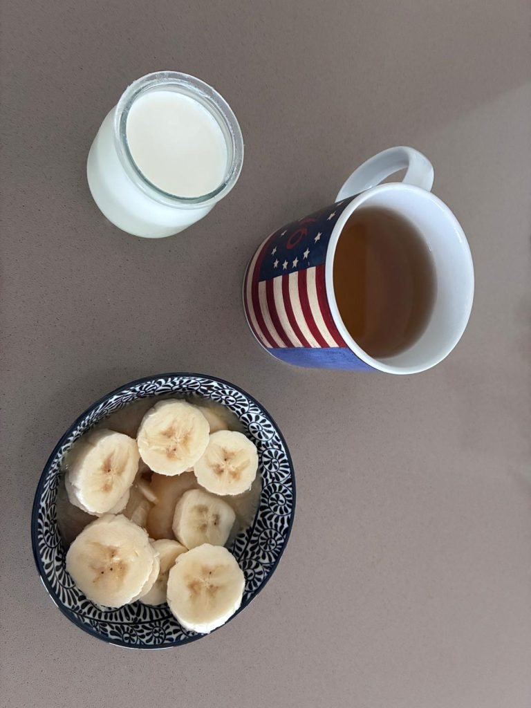 French breakfast with banana, applesauce, yogurt and tea