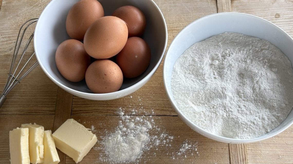 SImple baking ingredients: eggs, flour, butter, whisk for cooking with children