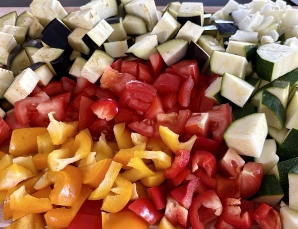 Easy baked ratatouille recipe ingredients with zucchini, eggplant, tomatoes, and peppers