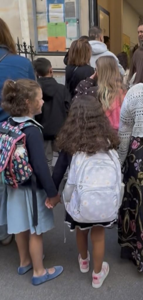 Elementary students outside the school gate in Paris