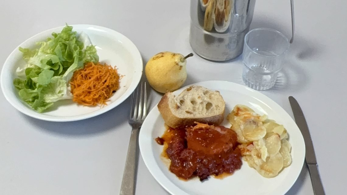 A complete lunch served at a French public elementary school, photographed during school lunch service.