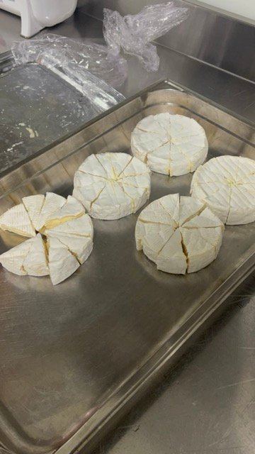 Camembert being prepared for French school lunch